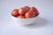 Tomato isolate. Tomatoes in a white bowl on white background.