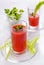 Tomato juice in glasses with parsley and celery. Fresh juice of