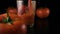 Tomato juice pours into a glass on the table. Slow mo.