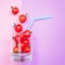 Tomato juice or smoothie, cherry tomato in drink glass with straw