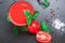 Tomato juice with spices seasoning basil on a black table. copy space, close up