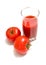 Tomato juice and two tomatos