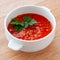 Tomato-lentil soup, decorated with herbs. Ingredients: tomatoes in their own juice, lentils, onions, spices. Square format