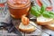 Tomato marinated quail eggs in a glass jar