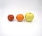 Tomato, orange, apple on the white background