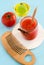 Tomato puree in a glass jar and olive oil for preparing homemade face and hair mask. Ingredients of DIY cosmetics.
