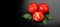 Tomato. Ripe natural tomatoes close-up. Organic tomato with leaves on black background