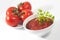 Tomato sauce bowl and plate with red tomatoes