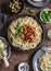 Tomato sauce mussels spaghetti on a wooden background, top view. Flat lay lunch table