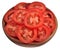 Tomato slices in a wooden bowl on a white