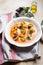 tomato soup with cappelletti pasta, cream and basil