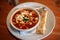 Tomato Soup With Goat Cheese and Flat Bread Stick