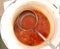 Tomato soup in a saucepan with a ladle. Tasty lunch. Color food photo, modern
