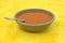 Tomato soup in stoneware bowl
