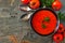 Tomato soup, top view corner border on a slate background