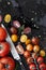 Tomato Varieties on Black Overhead View