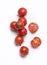 tomato with water droplets looks refreshing on a white background