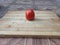 Tomato on a wooden surface. Fresh tomato on a cutting board. Tomato for salads, soups, pizza and ketchup.