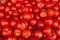 Tomatoes background, texture. Ripe red round gourmet tomatoes