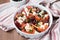 Tomatoes baked with cheese feta, smoked sausages, herbs, olives, Mediterranean dish
