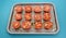 Tomatoes on a baking tray ready for roasting