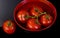 Tomatoes in bowl of water
