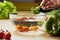 Tomatoes, broccoli and vegetables on kitchen table