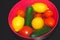 Tomatoes and cucumbers in a bowl. lemons in water. fresh vegetables