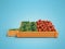 Tomatoes and cucumbers in box for sale 3d render on blue background with shadow