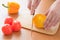 Tomatoes and cucumbers and peppers cutting board cooking knife.