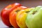 Tomatoes at different ripening stages. Focus is on Turned tomato.