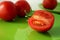 Tomatoes on a green plate