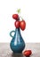 Tomatoes in High Blue Vase, isolated