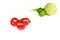 Tomatoes, lemons, cabbage, spring onions on a white background. Focus on tomatoes.