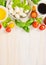 Tomatoes mozzarella salad making , ingredients on white wooden background, top view