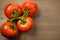 Tomatoes panicles on a wooden chopping board