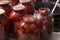 Tomatoes prepared for canning houses in glass jars