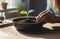 Tomatoes seedlings on a grey background. Young tomato pepper sprouts in pots