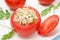 Tomatoes stuffed with tuna salad, bulgur and greens, close-up