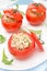 Tomatoes stuffed with tuna salad, bulgur and greens, top view