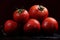 Tomatoes under water drops, red background