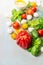 Tomatoes various with fresh basil and mozzarella on blue wooden background