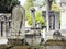 Tombstones in cemetery at dusk, gothic style crosses