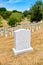 Tombstones on a grassy hill at Arlington National Cemetery