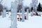 Tombstones in the old village cemetery in winter in Russia