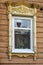 Tomsk, carved window of an old wooden apartment building