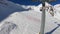 Tonale, Ponte di Legno, Italy. Hyperlapse chairlift with skiers moving to the top of the mountain in a wonderful sunny day