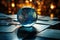 Toned image features a glass globe amid financial reports and graphs