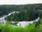 Toned image of majestic waterfall in the park Murchison Falls in Uganda against the background of the jungle