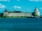 Toned image of a medieval fortress near the town of Saint Petersburg in Russia against a blue sky